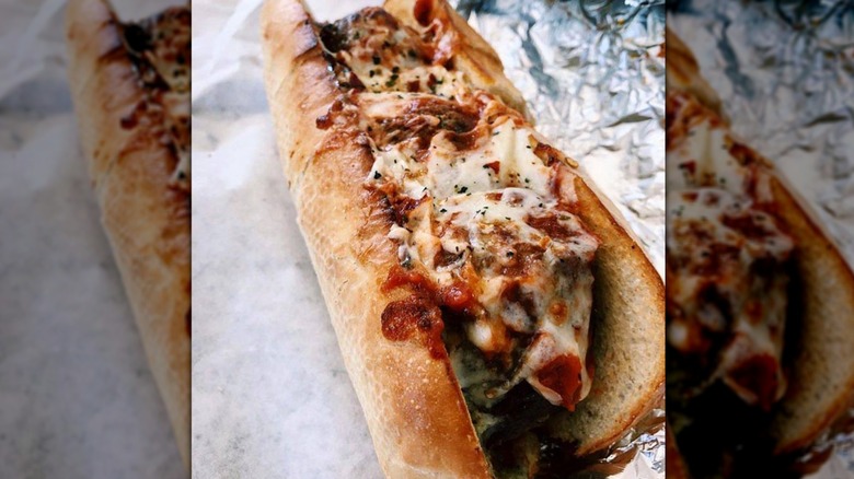 Full meatball sub on foil and paper wrap