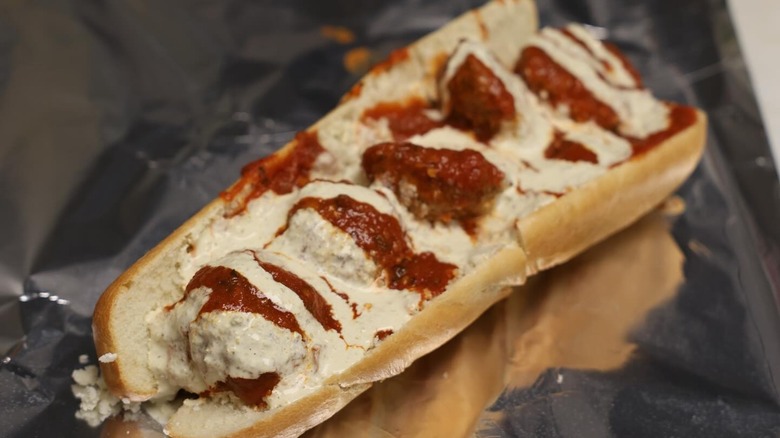 Meatball sub with cream sauce on foil
