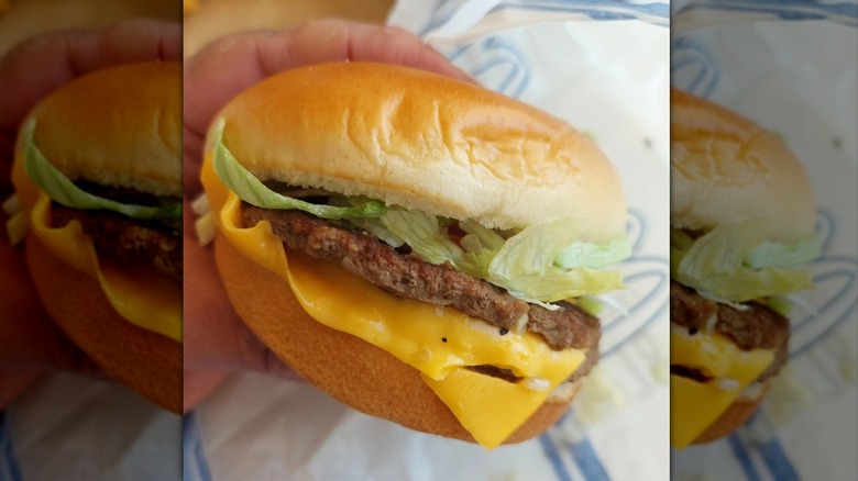 McDonald's burger with lettuce and cheese on steamed bun