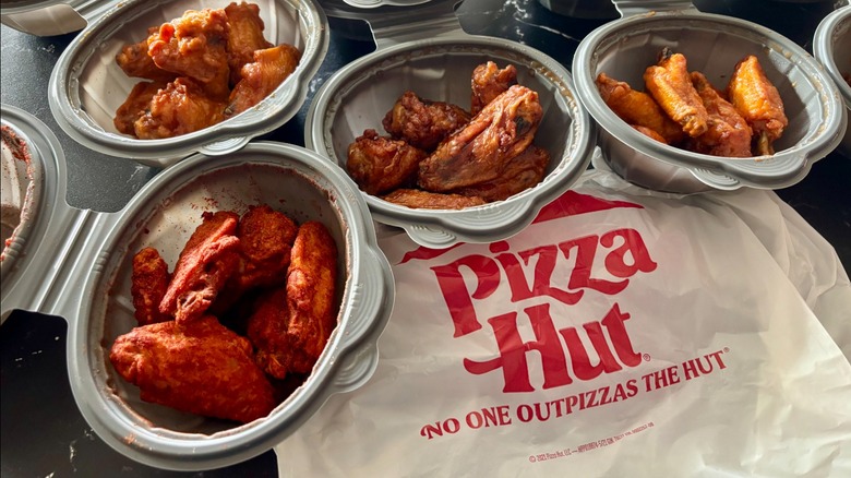 Array of different Pizza Hut wing flavors