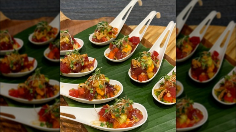 White spoons with poke bowl samples