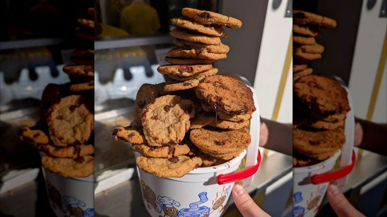 Towering and overflowing bucket of chocolate chip cookies