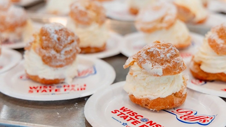 Multiple cream puffs on state fair branded plates