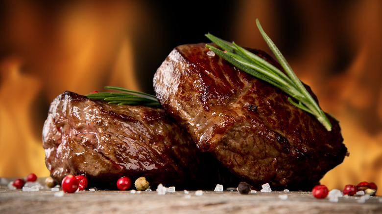 Perfectly prepared steaks before flames