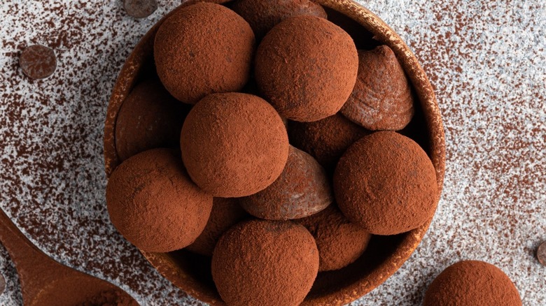 Top-down view of a bowl of chocolate truffles