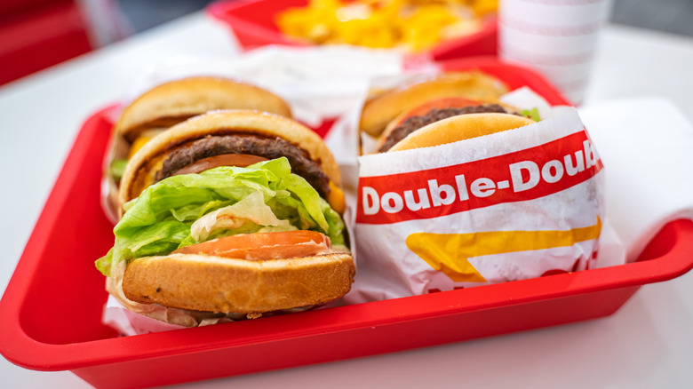 In-N-Out branded Double-Double burgers on a red tray