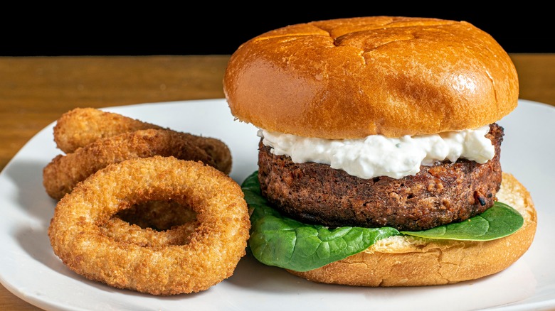cottage cheese on hamburger with onion rings