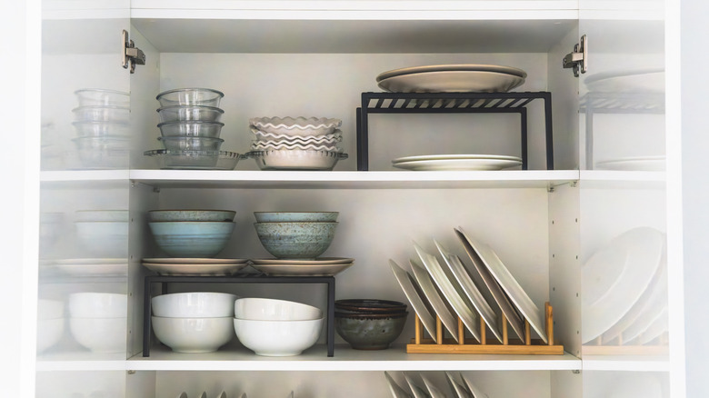 Bowls and plates in a kitchen cabinet