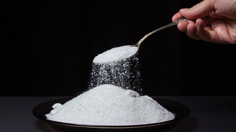 Salt poured with a spoon
