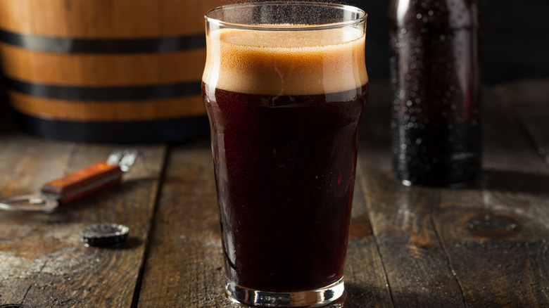 A glass of root beer on a table