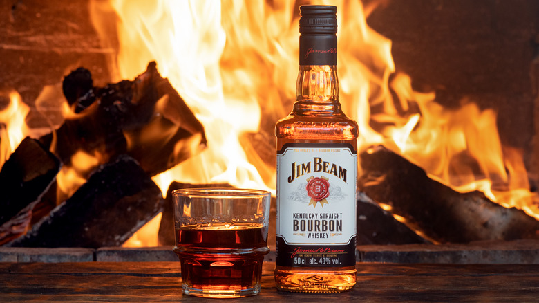 Jim Bean bourbon by fireplace 