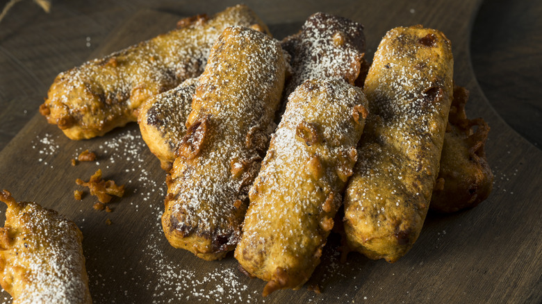 battered candy bars dusted with powdered sugar