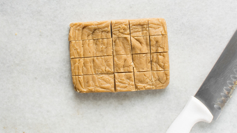 Slab of homemade fudge sliced into cubes