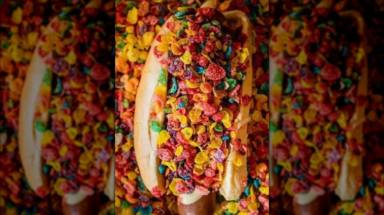 The Rubble Rage hot dog on a backdrop of Fruity Pebbles
