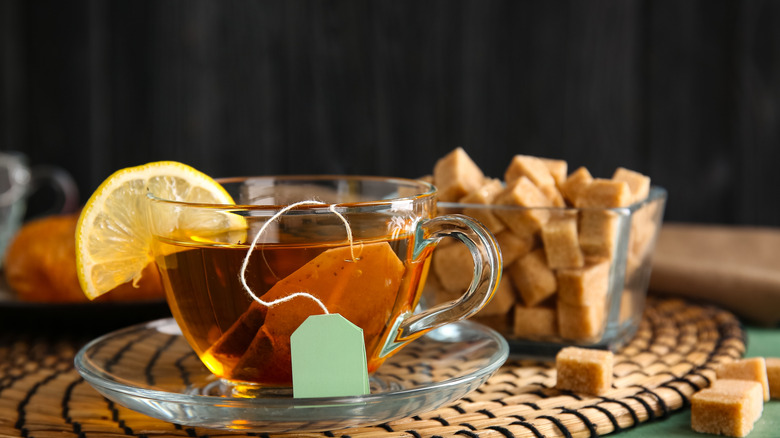 A cup of lemon tea with steeping tea bag