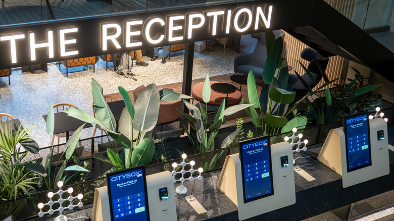 Hotel reception area with modern kiosks