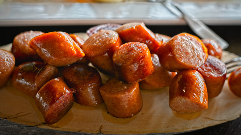 Greasy cut up reindeer sausages