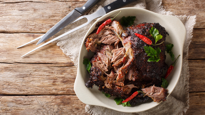 Slow-cooked pork with chiles and herbs