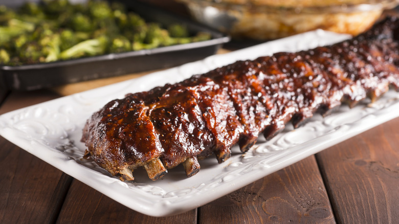 Rack of barbecue pork ribs on a platter