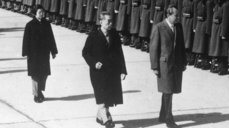 Nixon and Zhou walking together