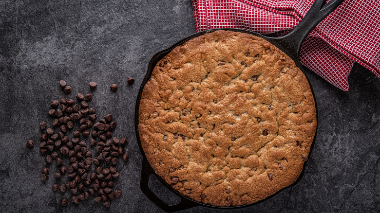 Chocolate chip cookie in a cast iron skillet