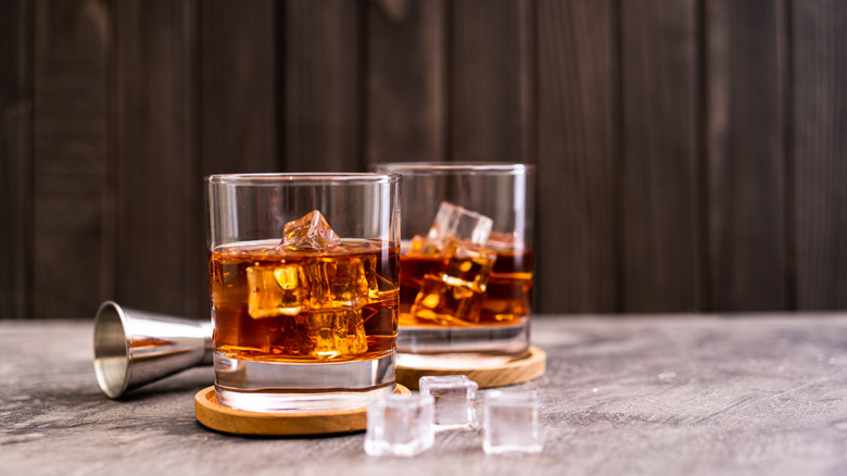 bourbon served in drinking glasses