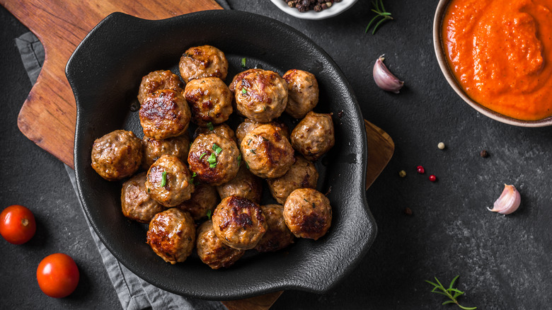 Cooked meatballs in skillet