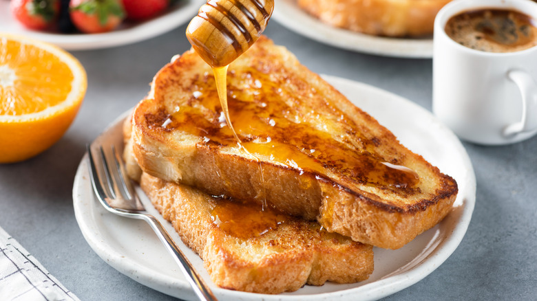 drizzling honey on French toast