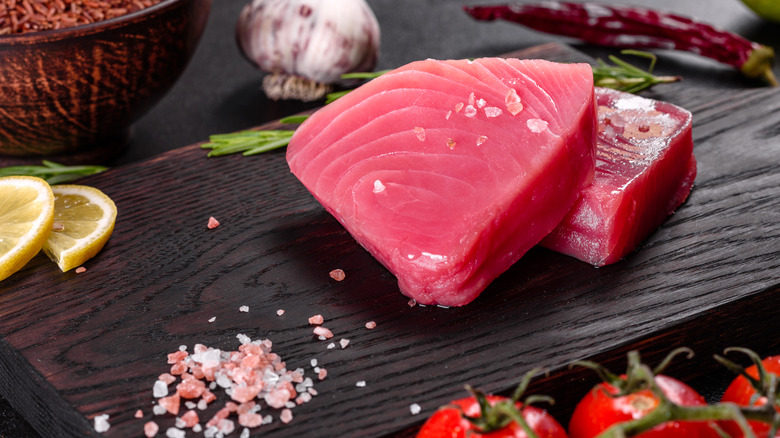 Raw tuna on wooden board
