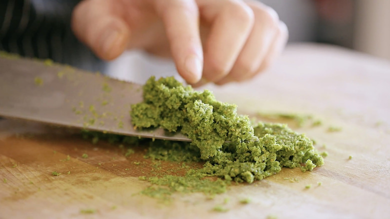 Yuzu kosho being scooped up by a knife