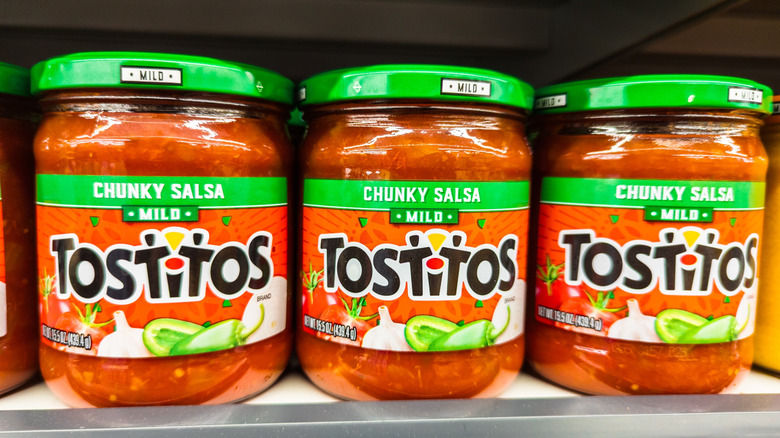 Jars of Tostitos salsa on a shelf