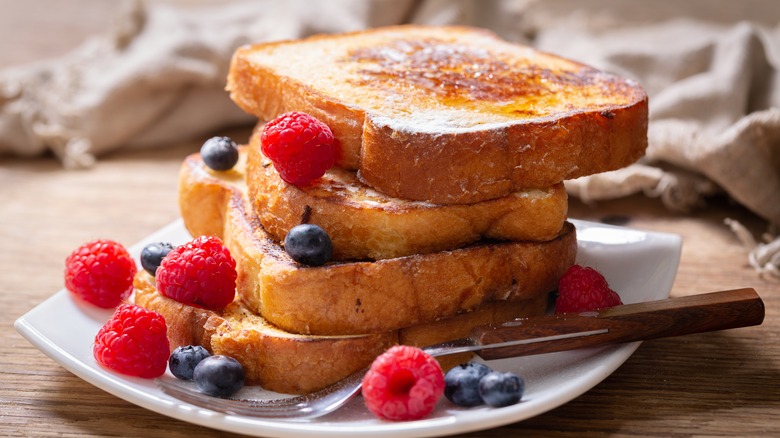 French toast and berries on plate
