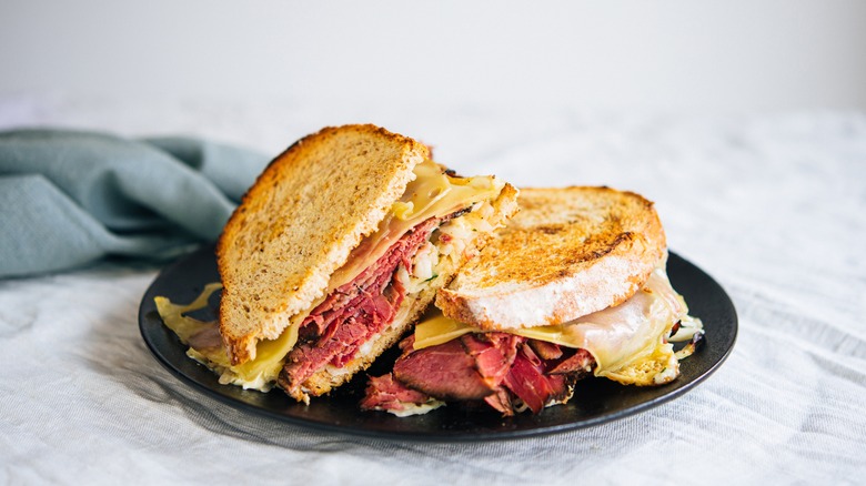 Reuben sandwich served on plate