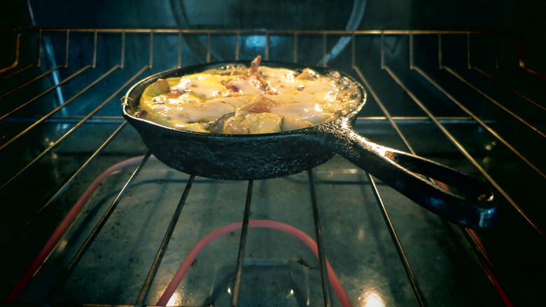 Skillet sitting with food in the oven