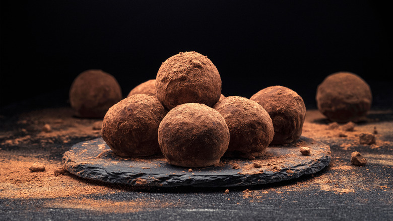 Several chocolate truffles.