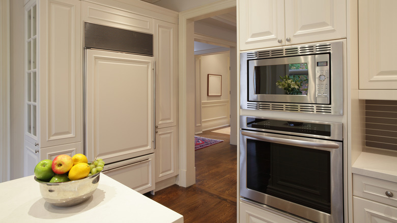 A modern kitchen with paneled appliances