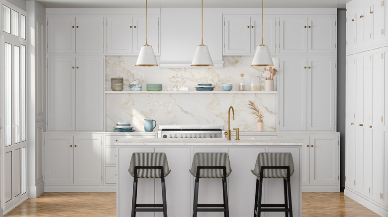 Luxury Timeless ktchen with white cabinets, island and classic stools
