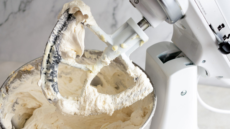 Closeup of a kitchen mixer with a side-blade beater attachment