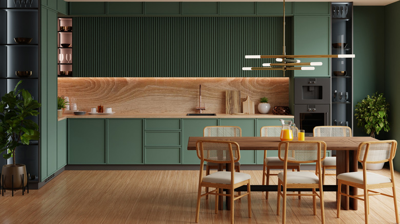 Kitchen with olive green painted walls and cabinets
