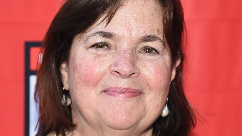 Close up of Ina Garten smiling with pearl earrings