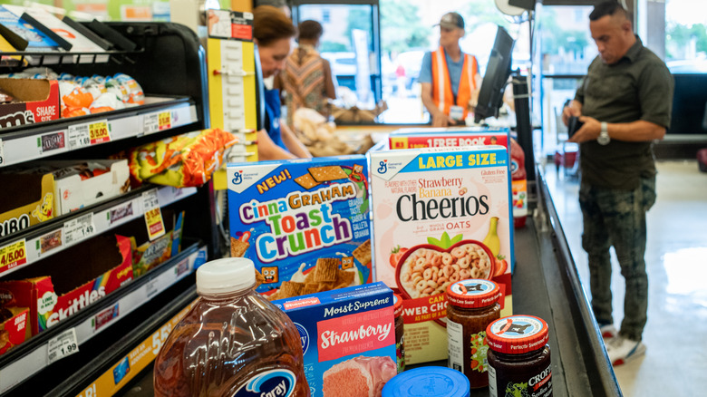 Groceries on a conveyer built at checkout at a Kroger grocery store