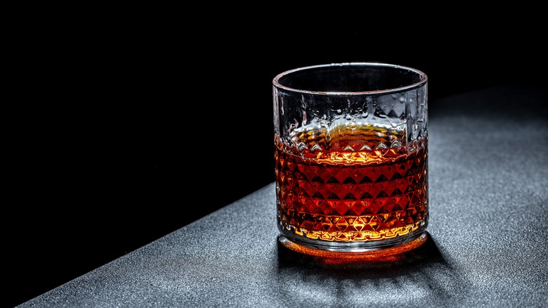 glass of bourbon in tumbler