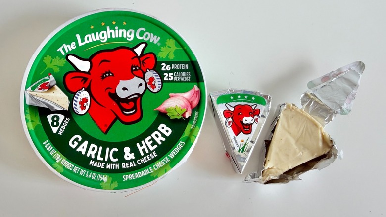 Laughing Cow Garlic & Herb spreadable cheese wedge