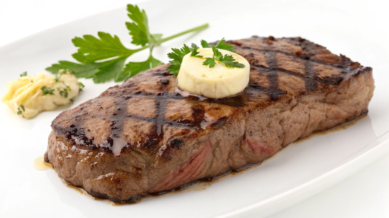 Top sirloin with garlic butter garnish