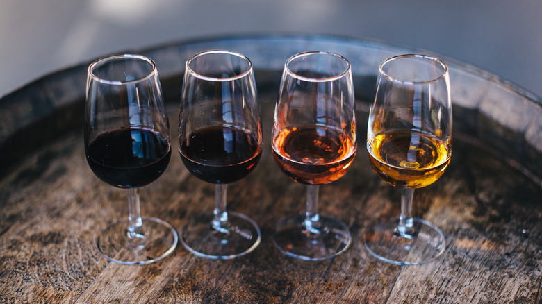 glasses of port wine on barrel