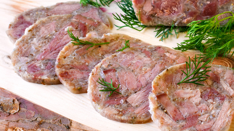 sliced head cheese with herbs