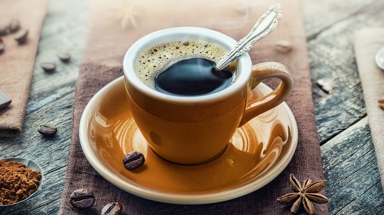 A mug of coffee on a saucer
