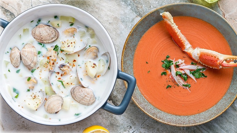 Bowls of crab bisque and clam chowder side by side