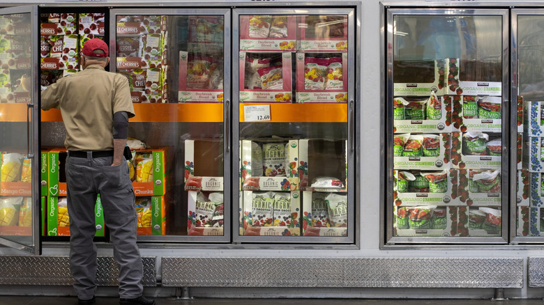 Man standing at the frozen fruit section at Costco