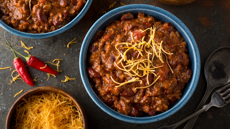 bowls of chili and cheese